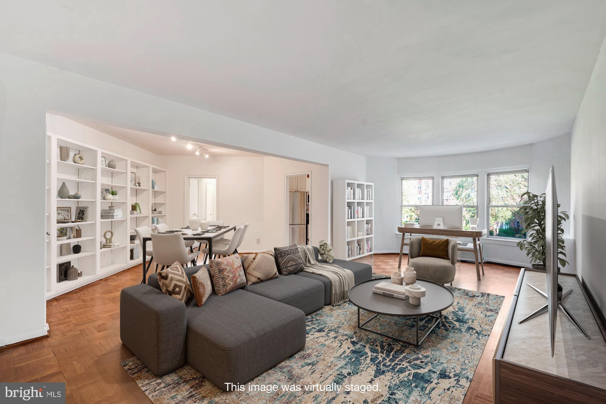 2500 Q Street Northwest, Unit 216 Washington, DC 20007 - Photo 2 of 38 a living room with furniture and a large window