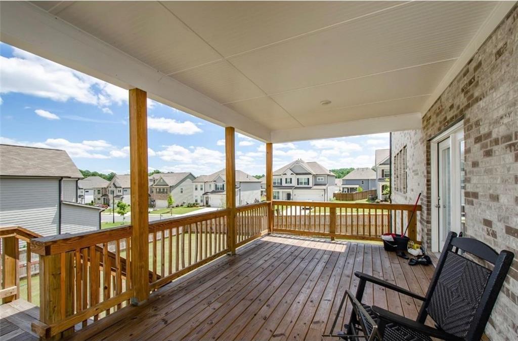 7410 Ansley View Lane Cumming, GA 30028 - Photo 16 of 35 a view of a balcony with wooden floor