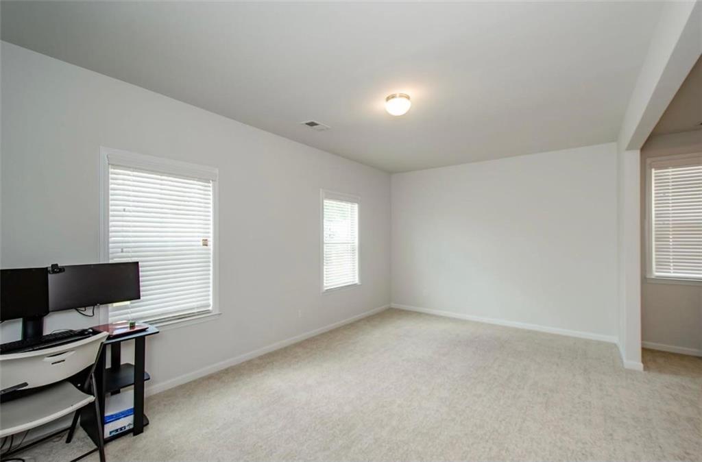 7410 Ansley View Lane Cumming, GA 30028 - Photo 21 of 35 a view of room with workspace and a window