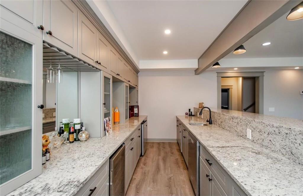 7410 Ansley View Lane Cumming, GA 30028 - Photo 9 of 35 a bathroom with sink and mirror