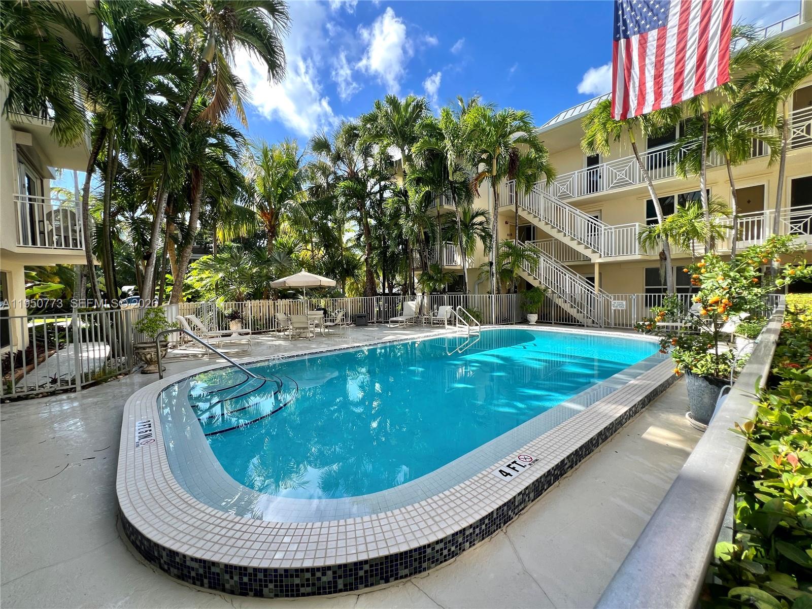 255 Sunrise Drive, Unit 308 Key Biscayne, FL 33149 - Photo 12 of 18 a view of swimming pool with a patio