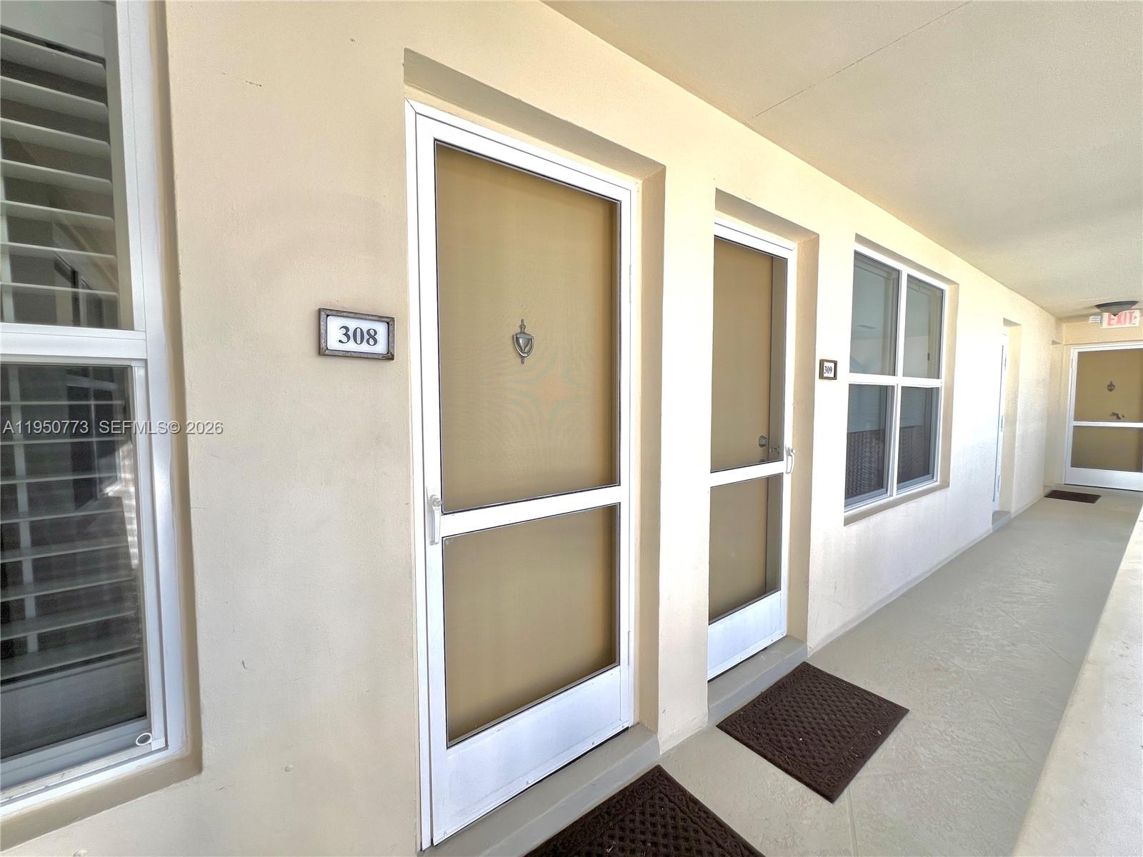 255 Sunrise Drive, Unit 308 Key Biscayne, FL 33149 - Photo 13 of 18 a view of walk in closet with empty racks