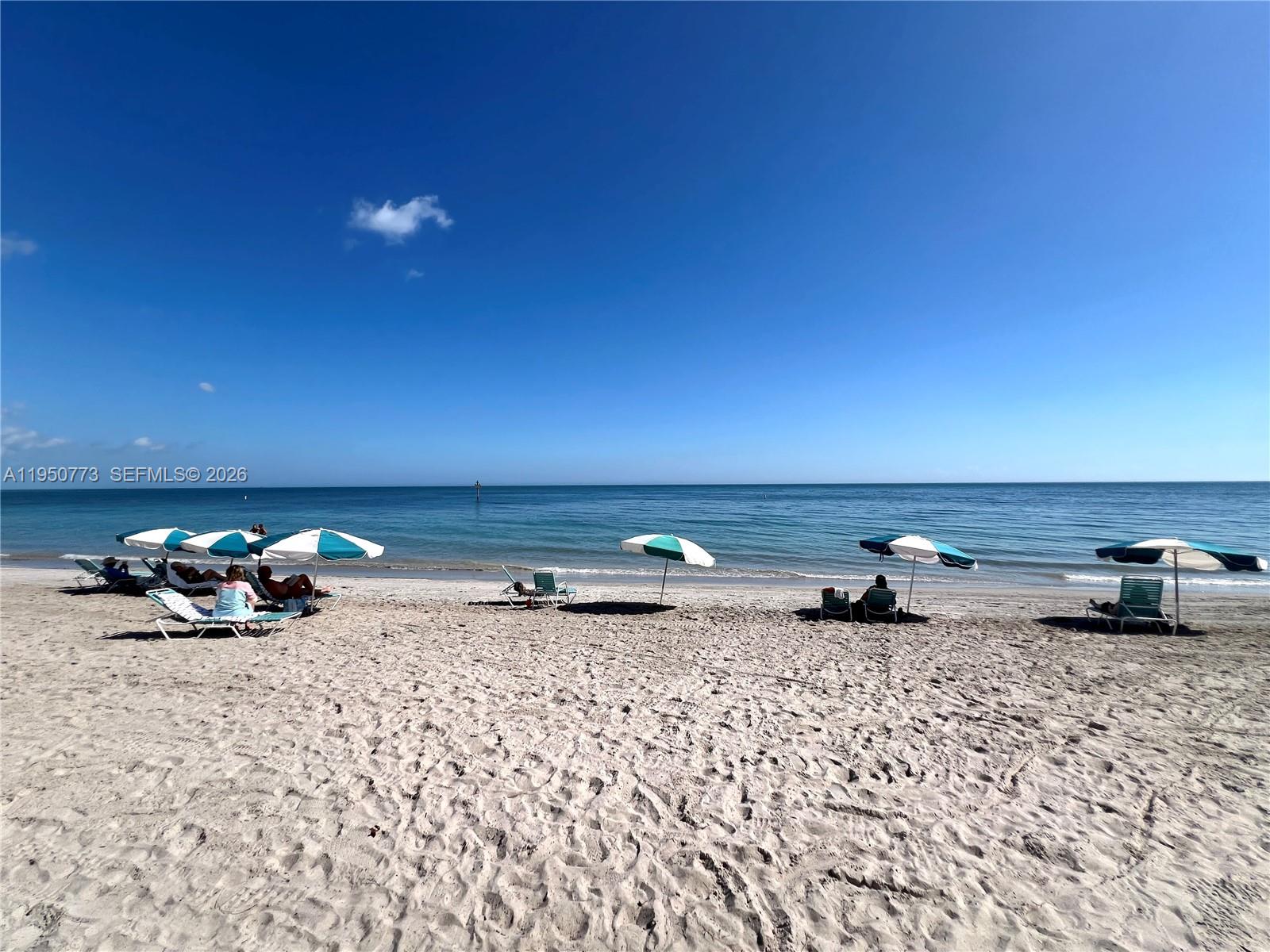 255 Sunrise Drive, Unit 308 Key Biscayne, FL 33149 - Photo 16 of 16 a view of car parked on the side of a road