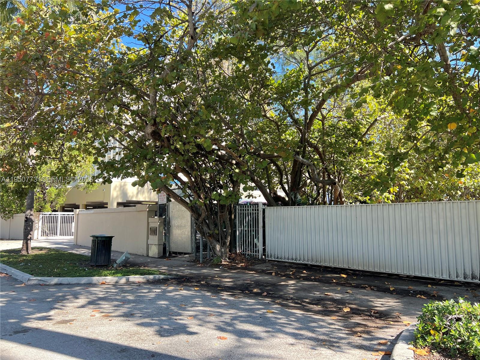 255 Sunrise Drive, Unit 308 Key Biscayne, FL 33149 - Photo 16 of 18 a view of a house with a tree