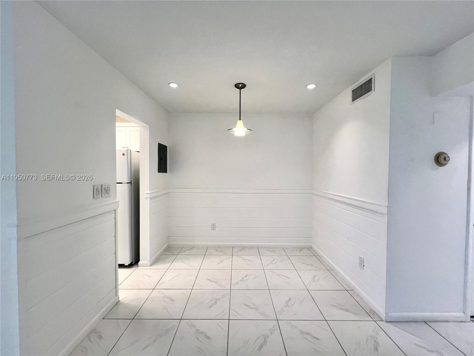 255 Sunrise Drive, Unit 308 Key Biscayne, FL 33149 - Photo 4 of 16 a view of an empty room and a window