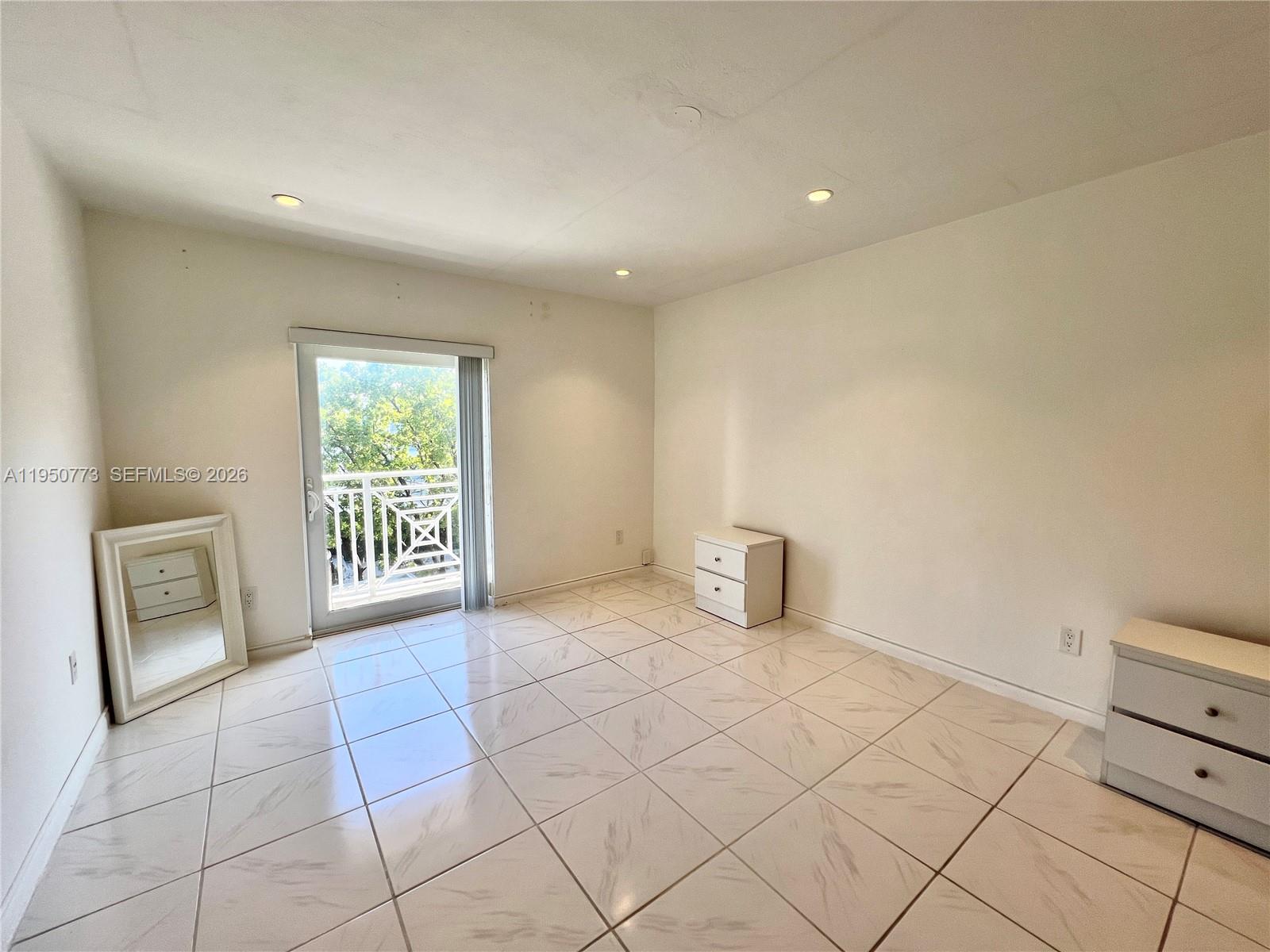 255 Sunrise Drive, Unit 308 Key Biscayne, FL 33149 - Photo 8 of 16 a view of an empty room and a window