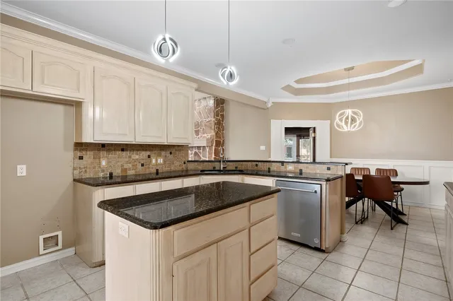 a kitchen with a sink cabinets and appliances