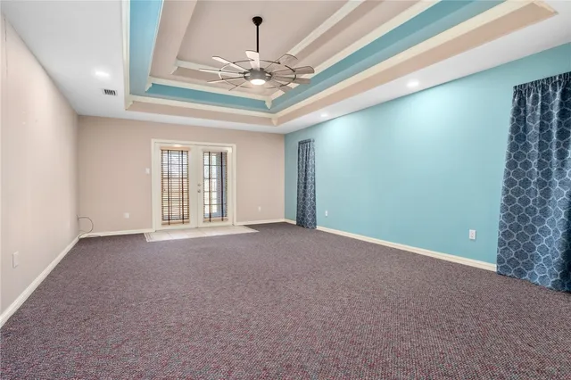 a view of an empty room with a chandelier