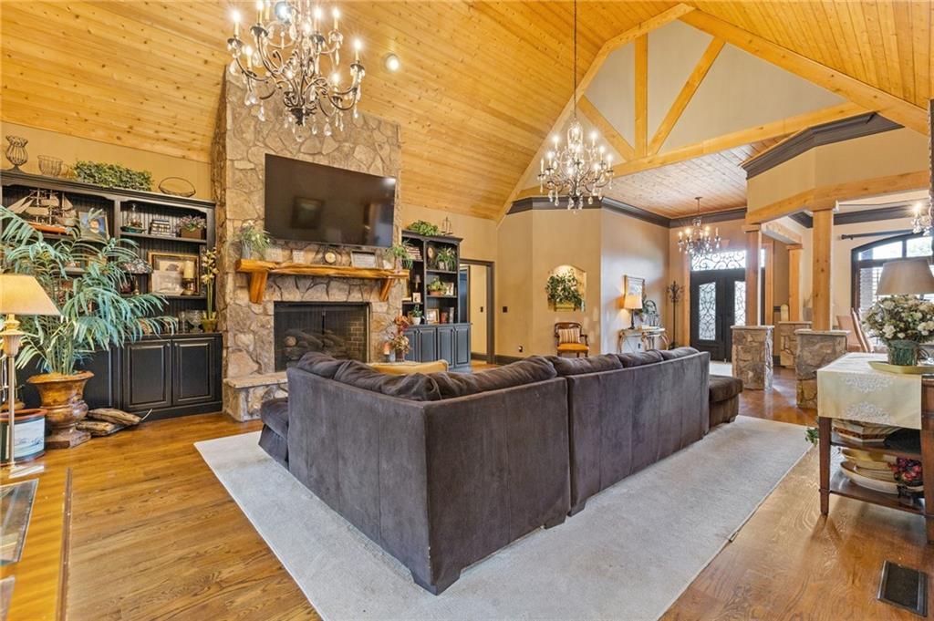 2932 Highway 124 Jefferson, GA 30549 - Photo 14 of 46 a living room with furniture a flat screen tv and a fireplace