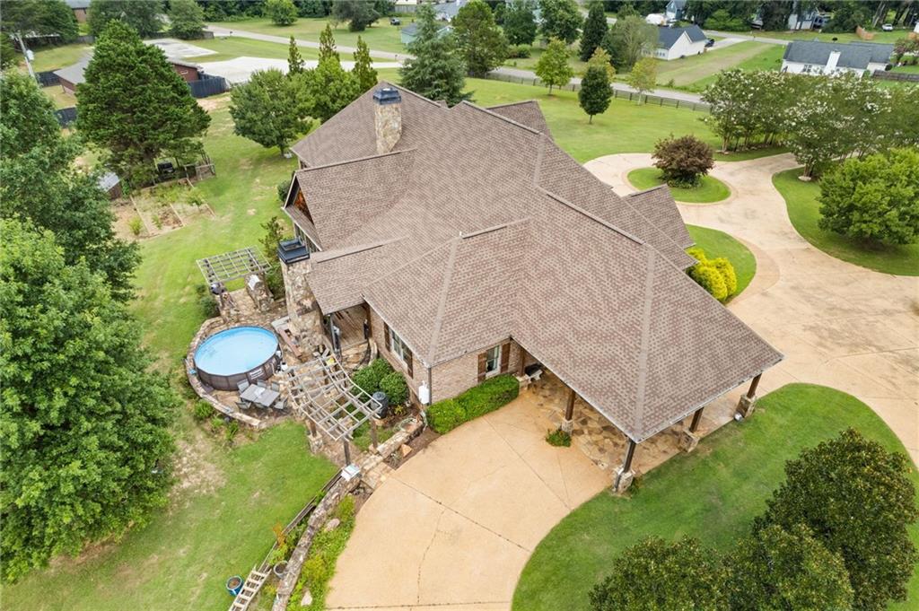 2932 Highway 124 Jefferson, GA 30549 - Photo 27 of 46 a view of a swimming pool with a yard and plants