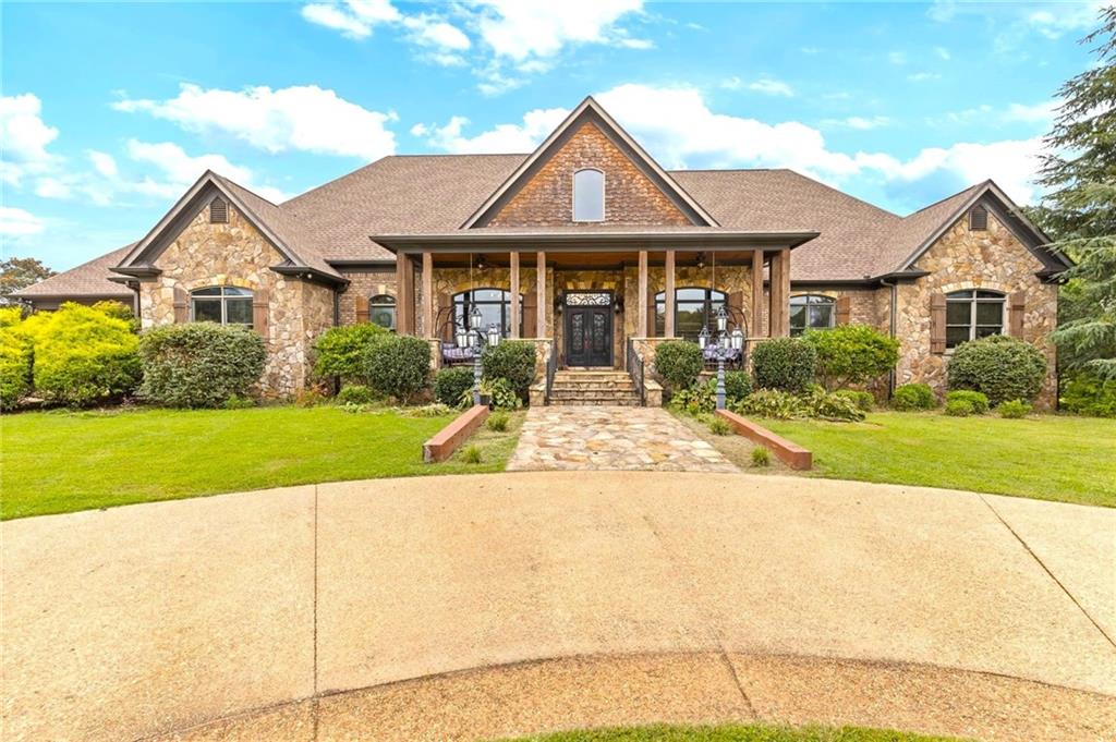 2932 Highway 124 Jefferson, GA 30549 - Photo 3 of 46 a front view of a house with a yard
