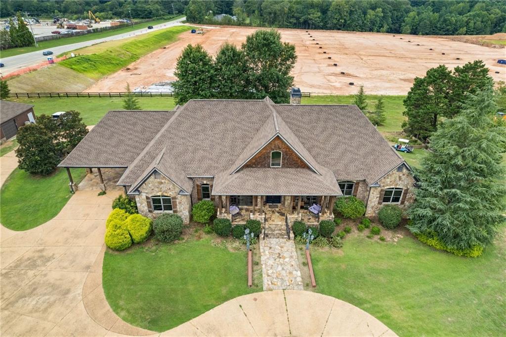 2932 Highway 124 Jefferson, GA 30549 - Photo 38 of 46 a aerial view of a house with swimming pool and green space