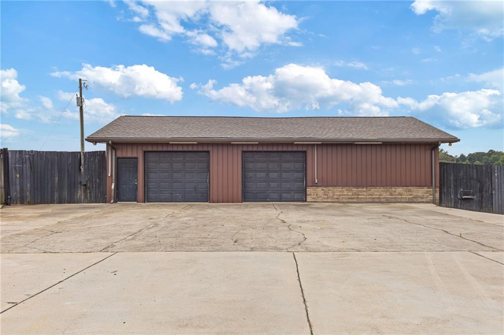 2932 Highway 124 Jefferson, GA 30549 - Photo 44 of 46 a front view of a house with a yard and garage