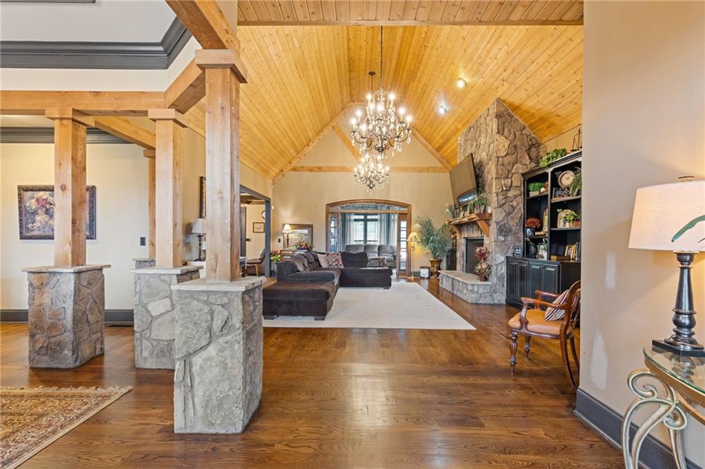 2932 Highway 124 Jefferson, GA 30549 - Photo 7 of 46 a living room with fireplace furniture and a chandelier