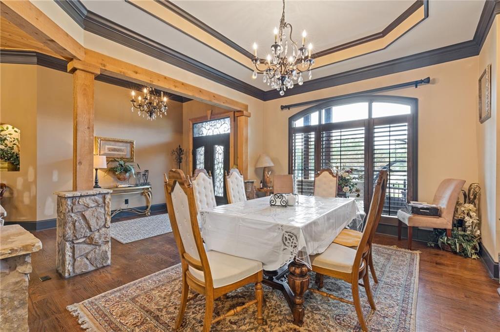 2932 Highway 124 Jefferson, GA 30549 - Photo 10 of 46 a view of a dining room with furniture a chandelier and wooden floor