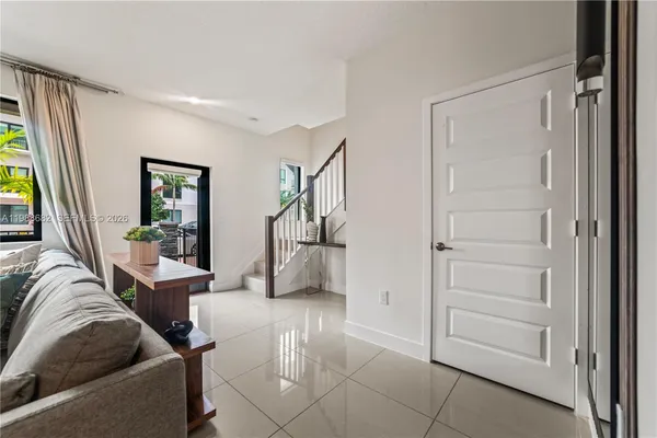 a living room with furniture and a window