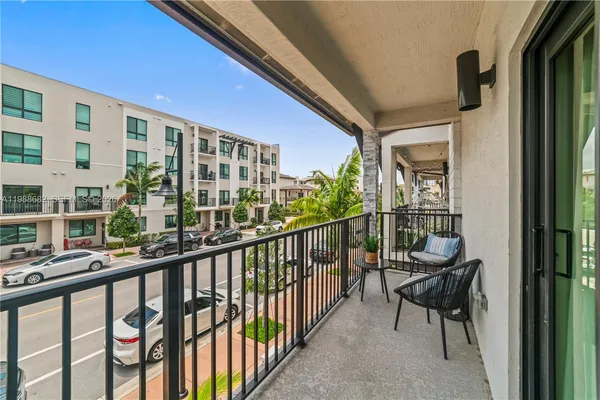 a view of a balcony with chairs