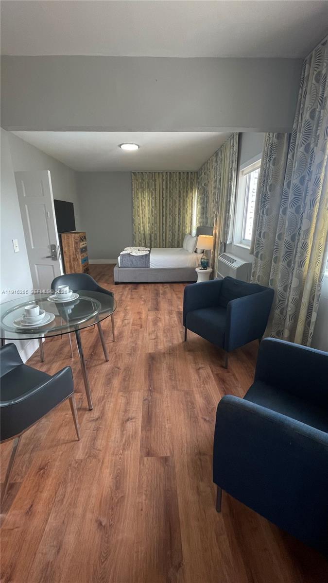 8100 Harding Avenue, Unit 508 Miami Beach, FL 33141 - Photo 20 of 20 a living room with furniture and wooden floor