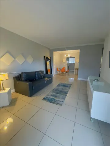 a spacious bathroom with a tub and mirror