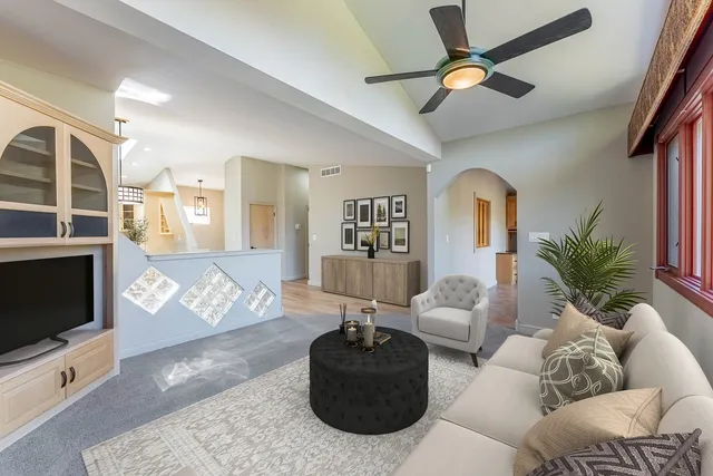 a living room with furniture and a fireplace