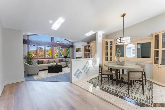 a view of a kitchen with a sink and wooden floor