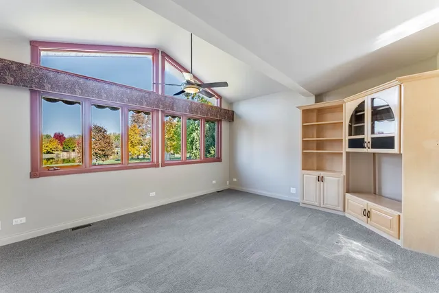 a spacious bathroom with a toilet sink and mirror