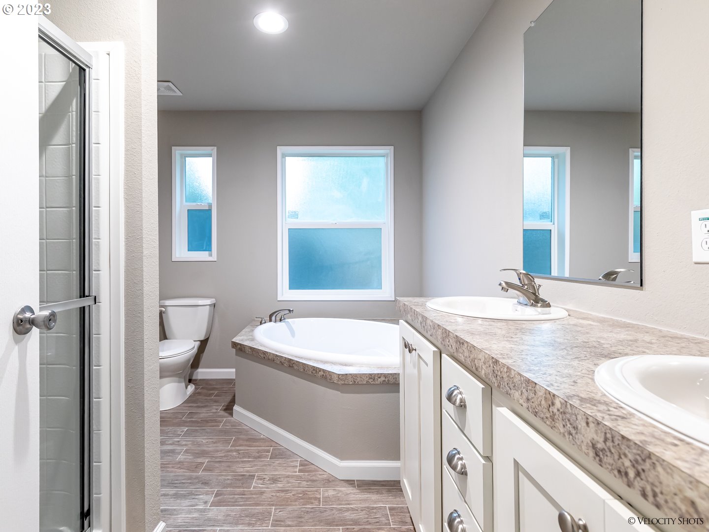 65195 East Sandy River Lane Rhododendron, OR 97049 - Photo 23 of 29 a bathroom with a granite countertop sink and a mirror