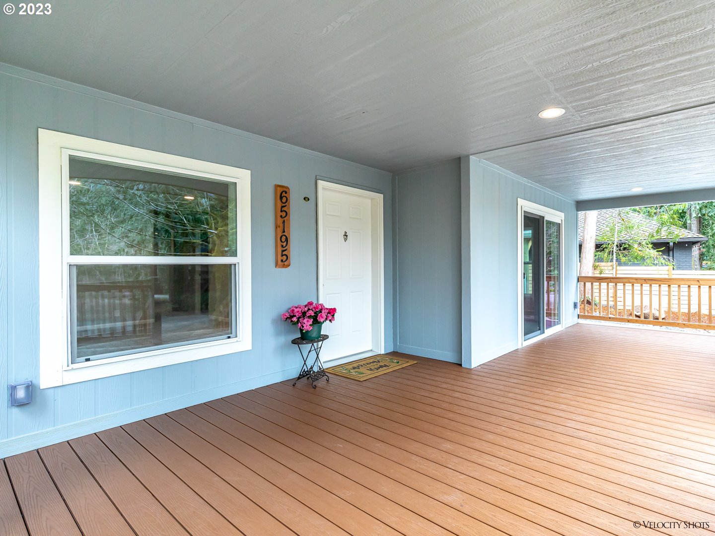 65195 East Sandy River Lane Rhododendron, OR 97049 - Photo 4 of 29 a view of an empty room with wooden floor and a window