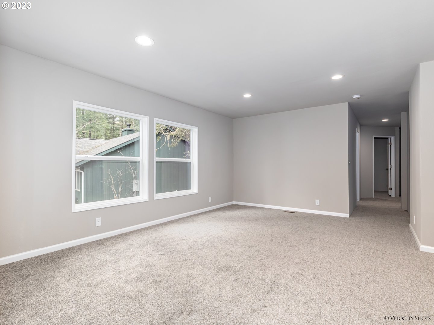 65195 East Sandy River Lane Rhododendron, OR 97049 - Photo 7 of 29 an empty room with a empty space and windows