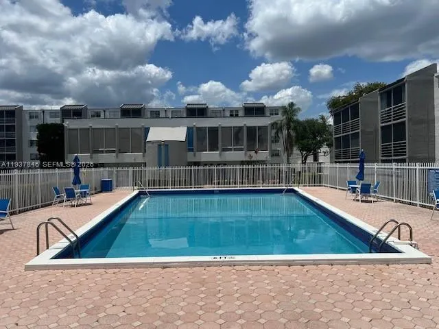 a view of a swimming pool with a lounge chairs