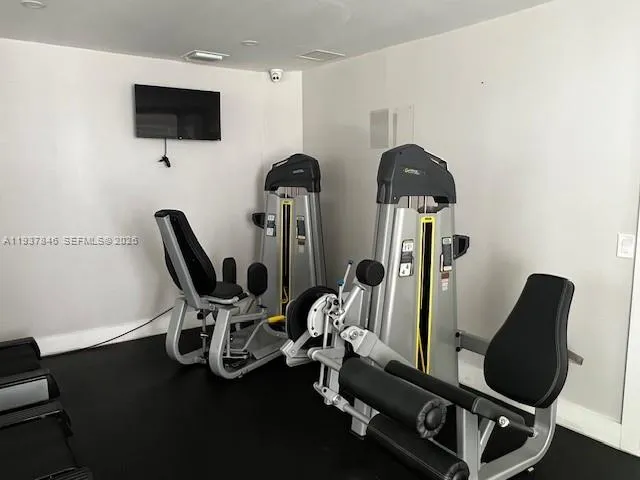 a room with furniture and wooden floor