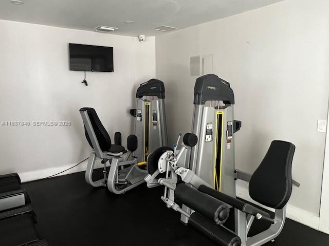 14165 Southwest 87th Street, Unit D202 Miami, FL 33183 - Photo 20 of 23 a room with furniture and wooden floor