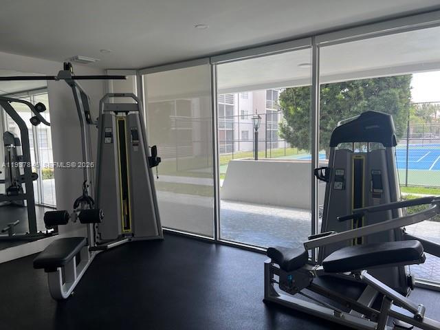 14165 Southwest 87th Street, Unit D202 Miami, FL 33183 - Photo 22 of 23 a view of a room with gym equipment