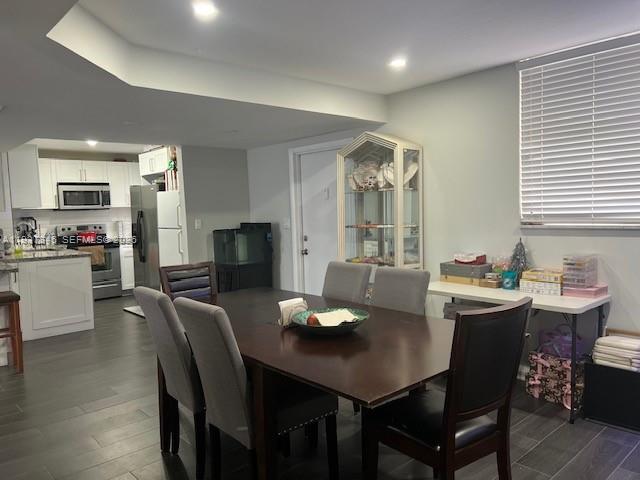 14165 Southwest 87th Street, Unit D202 Miami, FL 33183 - Photo 6 of 23 a view of a dining room with furniture
