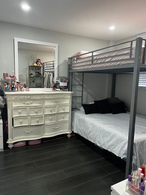 14165 Southwest 87th Street, Unit D202 Miami, FL 33183 - Photo 7 of 23 a room with a bed and a mirror