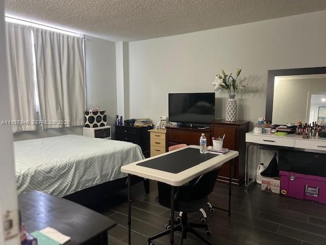 14165 Southwest 87th Street, Unit D202 Miami, FL 33183 - Photo 9 of 23 a living room with furniture and a flat screen tv