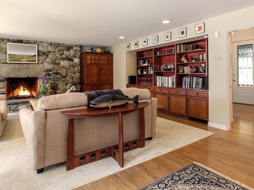 383 Harrington Road Pemaquid, ME 04558 - Photo 16 of 35 Family room with massive fieldstone...