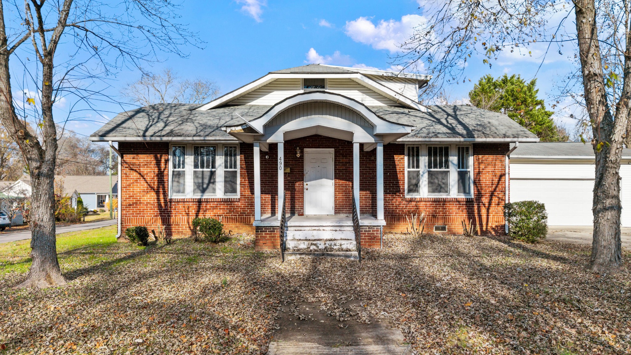490 8th Street Northwest Cleveland, TN 37311 - Photo 1 of 9 a front view of a house with a porch