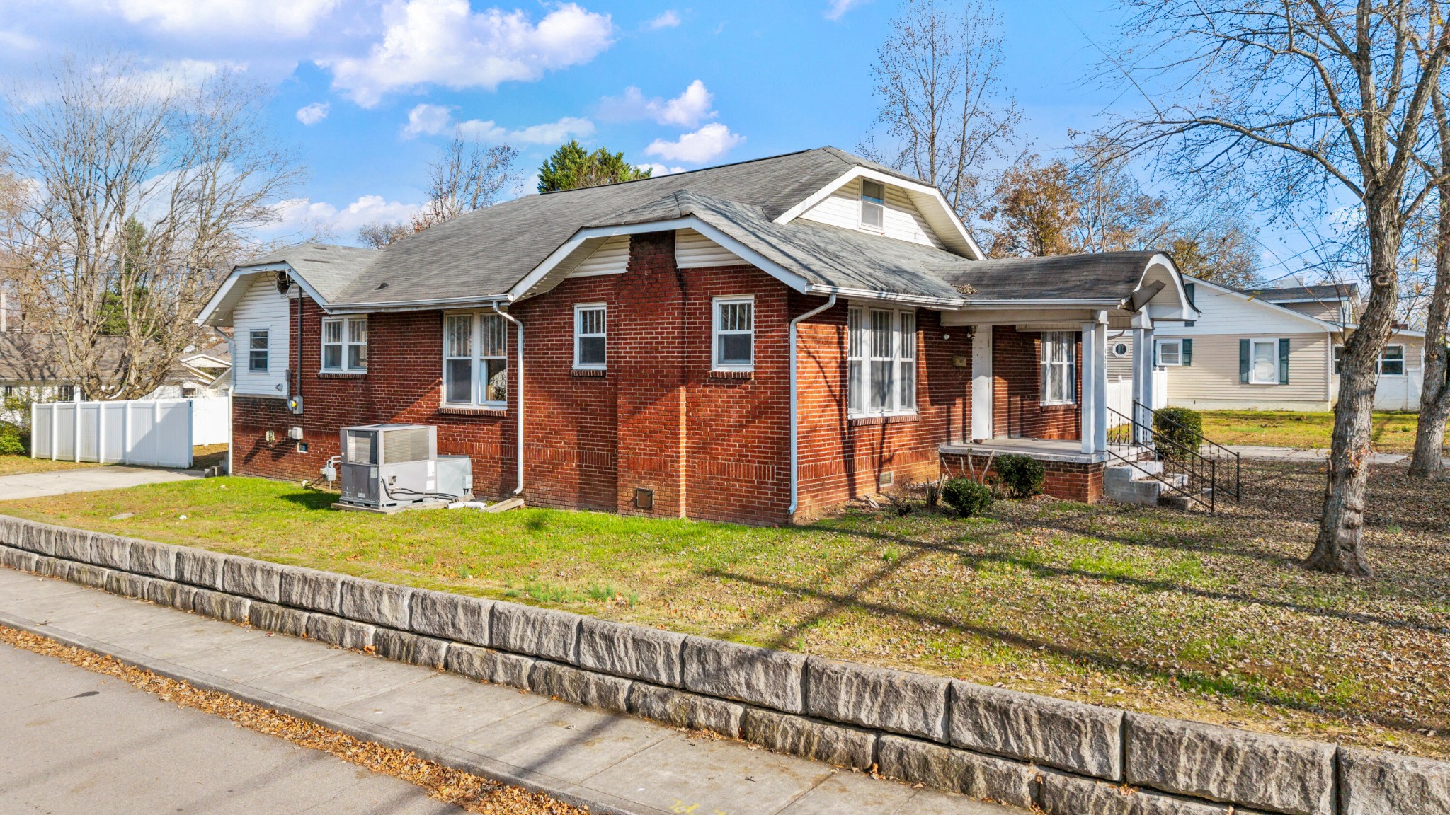 490 8th Street Northwest Cleveland, TN 37311 - Photo 6 of 9 a front view of a house with a yard
