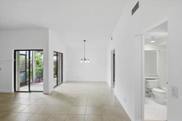 a view of a bathroom with a tub and shower