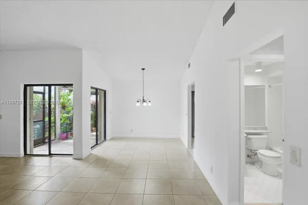 a view of a bathroom with a tub and shower