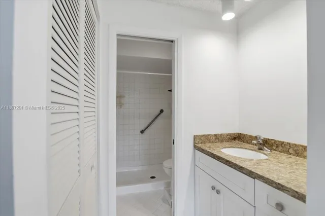 a bathroom with a sink a toilet and a bathtub