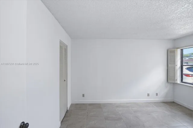 a kitchen with stainless steel appliances granite countertop a stove and a refrigerator