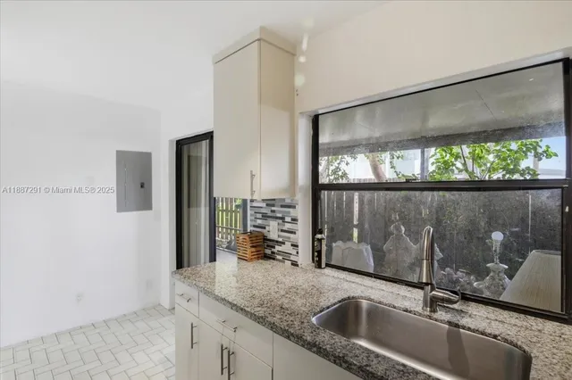 a view of a porch with chairs and floor