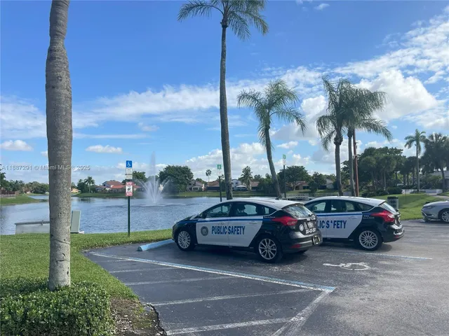 a backyard of a house with palm trees
