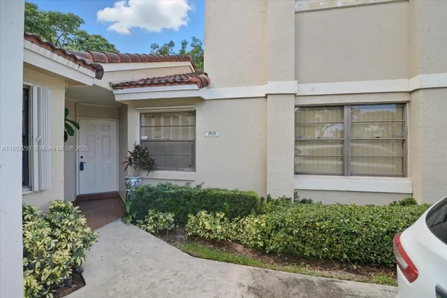 a view of an empty room with glass door