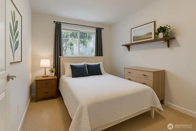 a bedroom with a bed and window