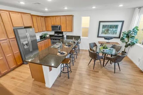 a view of a dining room with furniture window and wooden floor