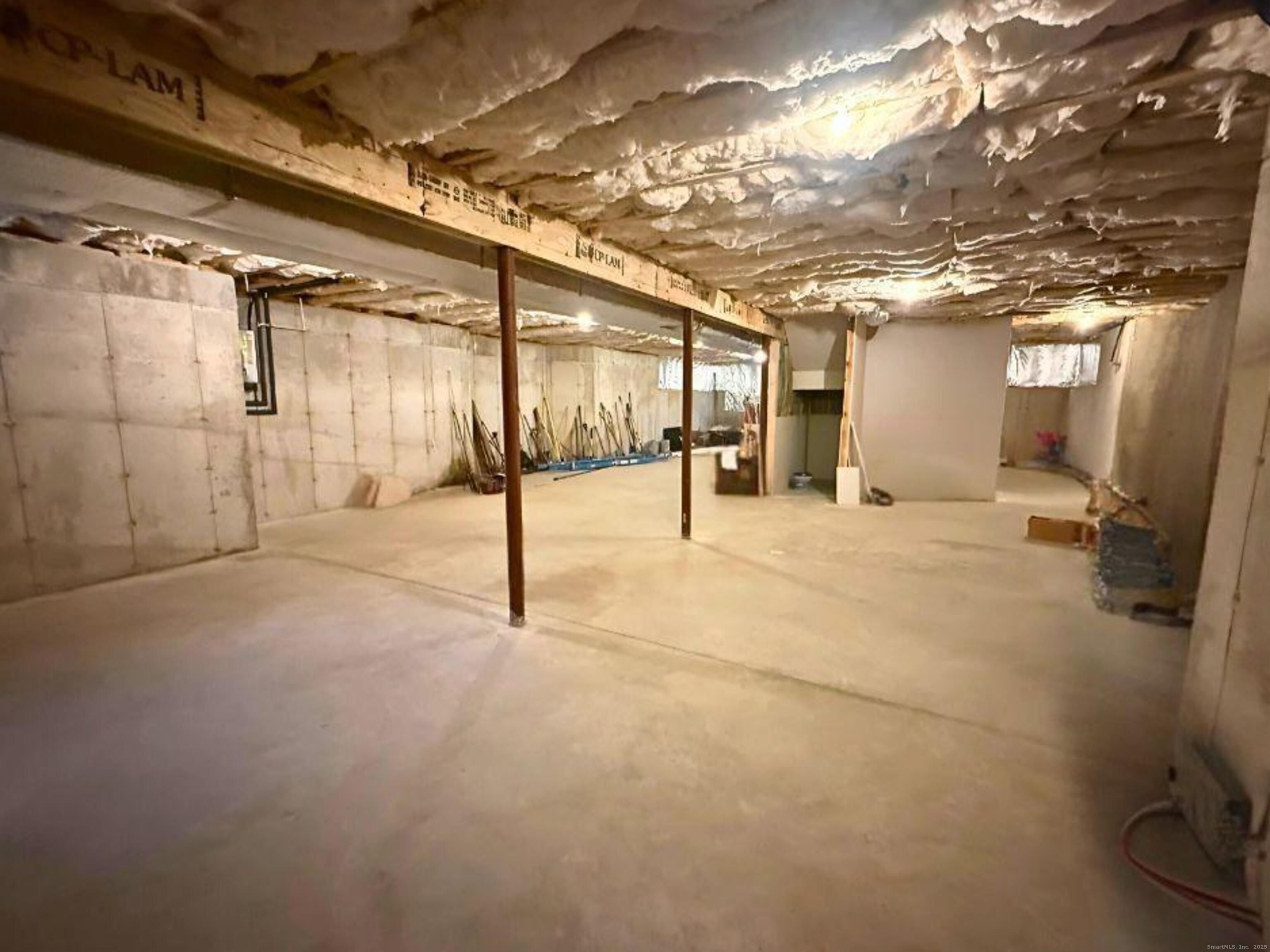 664 Sport Hill Road Easton, CT 06612 - Photo 33 of 35 10 foot ceilings in basement. Kitchen & bathroom roughed out plumbing is present for a potential in law set up or extra finished living space.