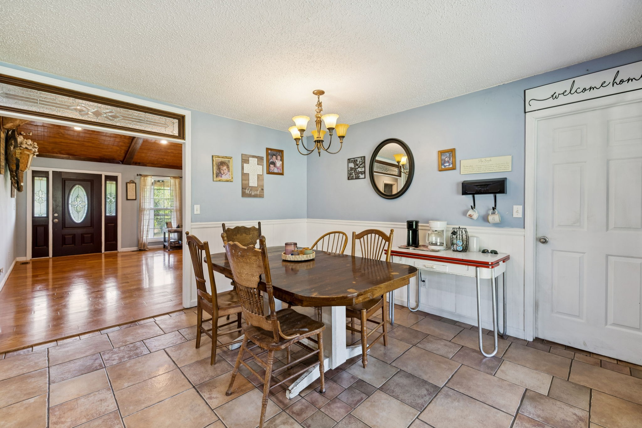 284 Duck Branch Road Fayetteville, TN 37334 - Photo 15 of 47 a view of a dining room and livingroom with furniture wooden floor a chandelier